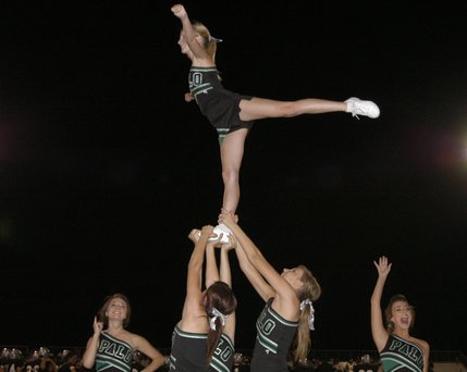 The Palo Verde varsity cheerleaders entertain the home crowd during a break in play Friday.