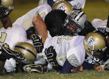 Palo Verde defensive lineman Daniel Godkin stuffs Cheyenne running back Donnell Thompson during the fourth quarter of Friday's game at Palo Verde High.