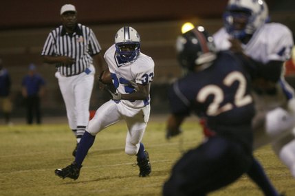 Basic running back Giovanni Gift (33) runs the ball during Friday's away game against Coronado.
