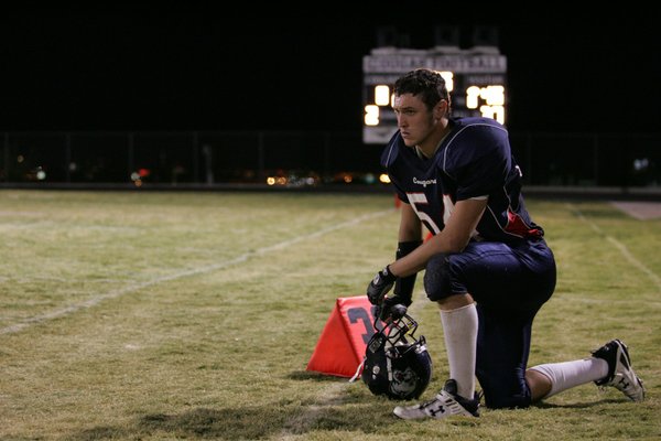 Coronado's Christopher Johnson (54) looks on from the sidelines during ...