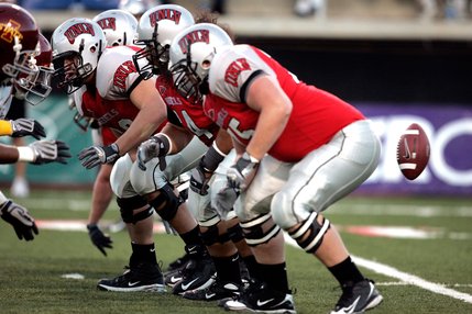 The UNLV offensive line hikes the ball during a game against Iowa State at Sam Boyd Stadium.