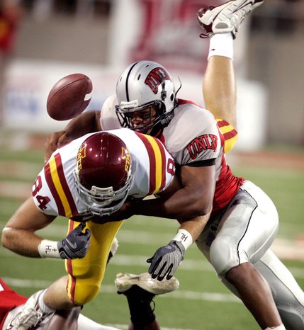 UNLV's Nate Carter, right, tackles Iowa State's Derrick Catlett at Sam Boyd Stadium.