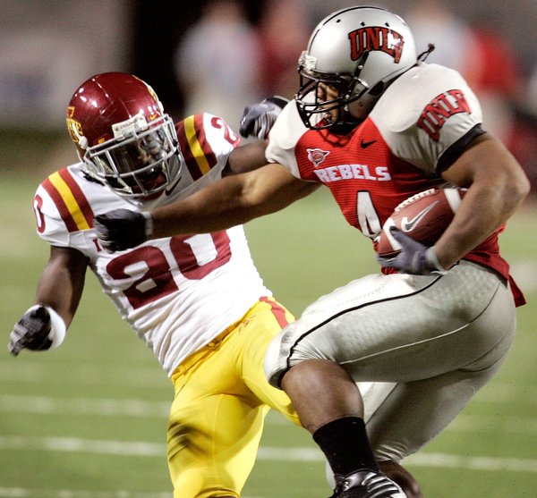 UNLV's Frank Summers, right, knocks down Iowa State's Brandon Hunley ...