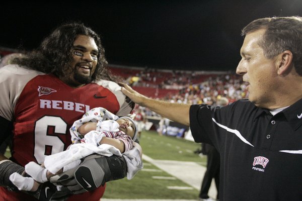 UNLV's Sifa Moala, left, is congratulated by head coach Mike ...