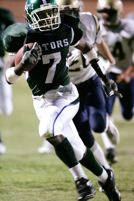 Green Valley's Quincy Bagsby runs for the first touchdown of the game during the first quarter of Friday's game against Foothill.
