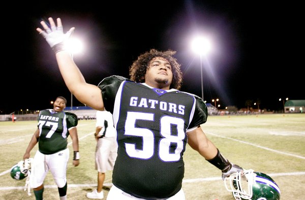 Brigham Tauteoli of Green Valley High School moves his arms ...