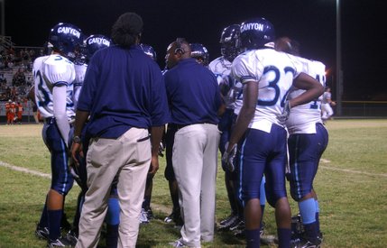 Canyon Springs head coach Chris Littmann talks to his players during a timeout on Friday night at Chaparral High School. 