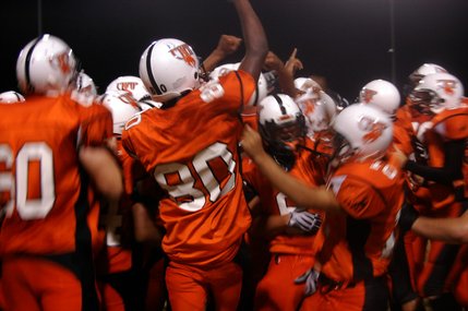 Chaparral players celebrate after their 23-20 win over Canyon Springs on Friday night. 