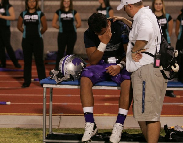 On the sidelines, Silverado fullback Marcus Mata'u wipes his face ...