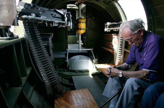 Epstein bows his head while waiting for takeoff during a ride in the B-17 on Thursday. He never flew in one during the war but the planes were a powerful symbol of Allied strength.