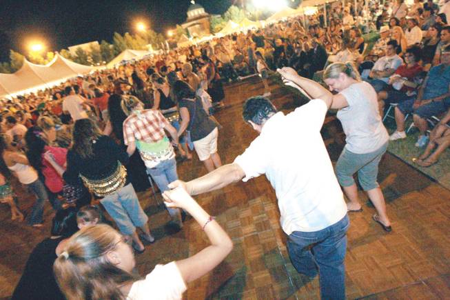 People dance to Greek music during the annual Greek Food Festival at St. John the Baptist Greek Orthodox Church.