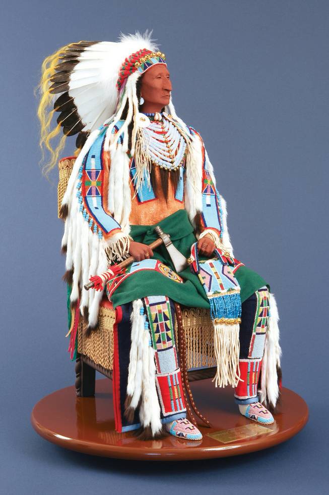 Inspired to capture the spirit of Chief Two Leggings of the Crow Tribe, American Indian artist Rhonda Holy Bear sculpted "Interview with a Warrior" out of wood, decorating the form with antique miniature glass beads, buckskin, cloth, ribbons, hair, turkey feathers and fur.

