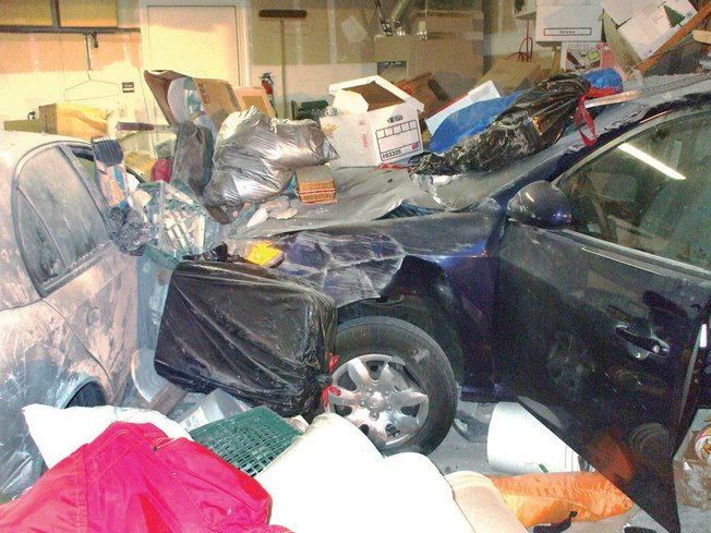 A car plowed into a garage on Norfolk Avenue on Sept. 13. The driver was taken to the hospital.