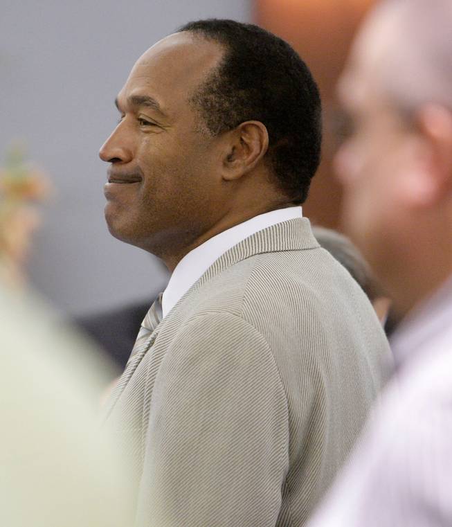 O.J. Simpson attends his trial at the Clark County Regional Justice Center Friday, Sept. 26, 2008, in Las Vegas. Simpson faces 12 charges, including felony kidnapping, armed robbery and conspiracy.