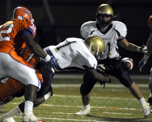 Spring Valley's Jacques Adams (1) loses the football during a ...