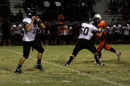 Las Vegas quarterback Emir Lopez gets ready for a pass during Friday's game at Chaparral.