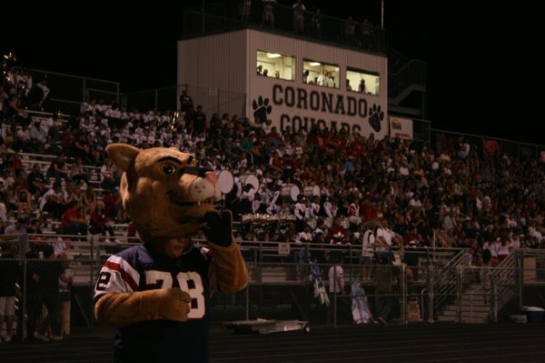 Cougar fans fill the bleachers and their mascot watches the ...