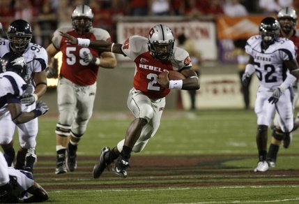 UNLV quarterback Omar Clayton runs with the ball against UNR at Sam Boyd Stadium.