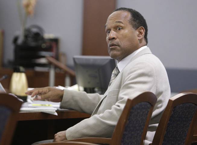 O.J. Simpson reacts to testimony from Michael McClintion during his trial at the Clark County Regional Justice Center Friday, Sept. 26, 2008, in Las Vegas. Simpson faces 12 charges, including felony kidnapping, armed robbery and conspiracy.
