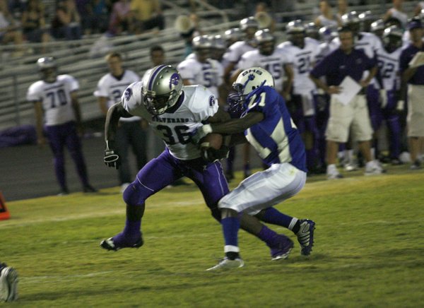 Silverado fullback Akeen Saint Victor (36) is tackled by Basic's ...