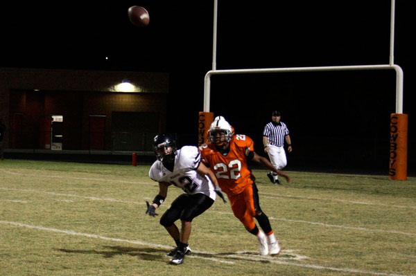Las Vegas' Tim Daniels (12) and Chaparral's Isaiah Washington (22) ...