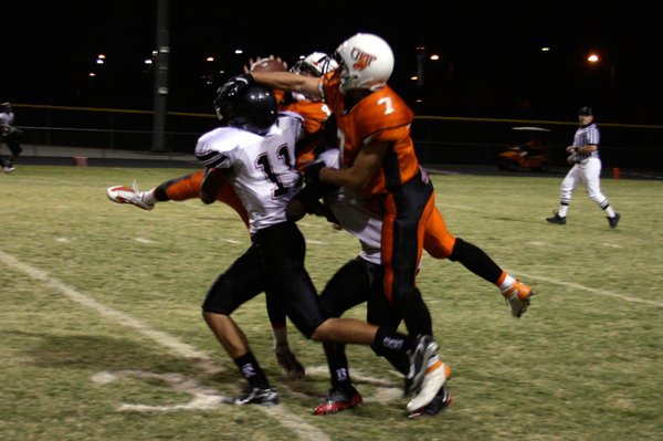 Chaparral's Edward Weist (4) and Greg Tucker (7) fight with ...