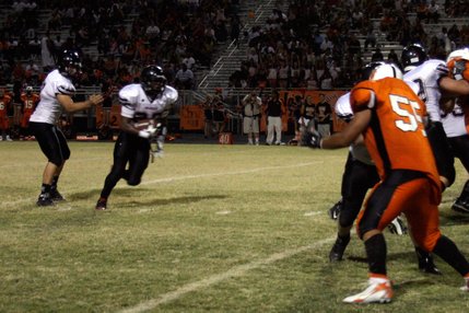 Las Vegas quarterback Emir Lopez (7) passes the ball to wide receiver Nico Villarama (27) during Friday's game at Chaparral.