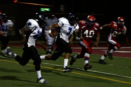 Desert Pines quarterback Dalton Leilua runs the ball for a touchdown during the third quarter of Friday's victory at Valley.
