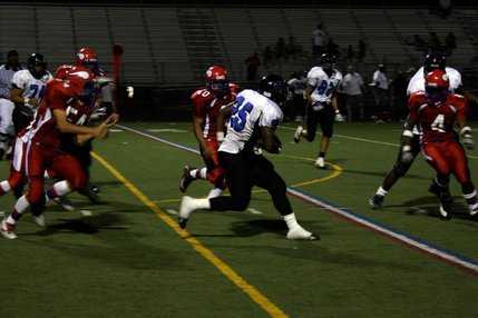 Desert Pines' Dennis Scott runs the ball during Friday's win at Valley.