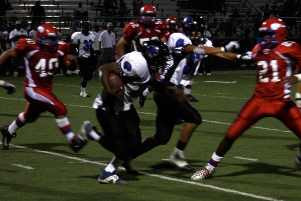 Derrick Shaw runs the ball for Desert Pines during the ...