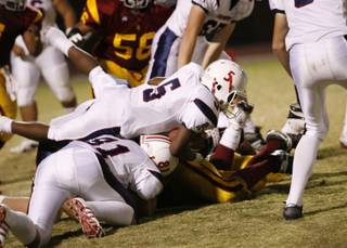 Liberty running back Ty Byrd looks for yardage against Del Sol Friday.