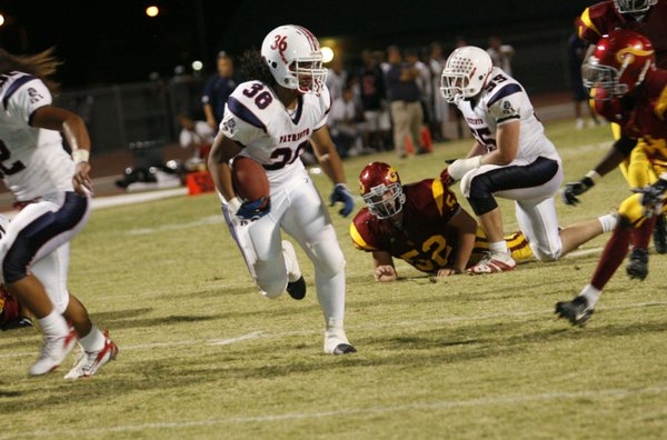 Liberty running back Jordan Kapeli (36) runs for a touchdown ...
