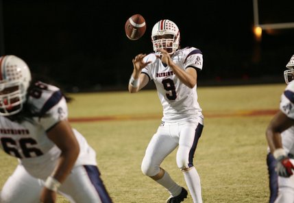 Liberty quarterback Robert Gilliland (9) calls a play during Friday's game at Del Sol.