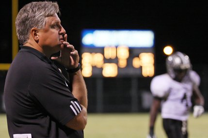 Palo Verde coach Darwin Rost watches from the sidelines as the players start a play during Friday's game at Centennial High School.
