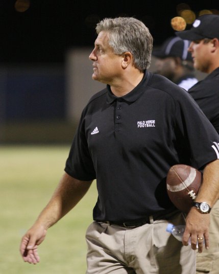 Palo Verde coach Darwin Rost watches from the sidelines as the players get ready for the next play during Friday's game at Centennial High School.