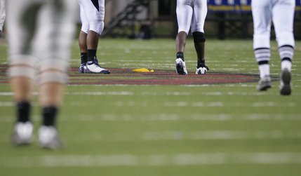 A flag for a holding penalty by UNLV sits on the field after a play during which wide receiver Ryan Wolfe ran a catch into the end zone in the first half.