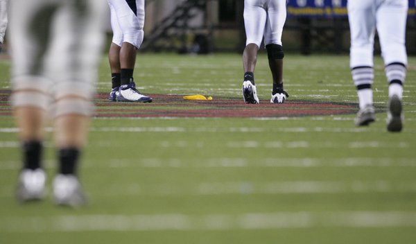 A flag for a holding penalty by UNLV sits on ...