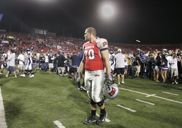 UNLV offensive lineman Jason Heath looks over his shoulder as ...