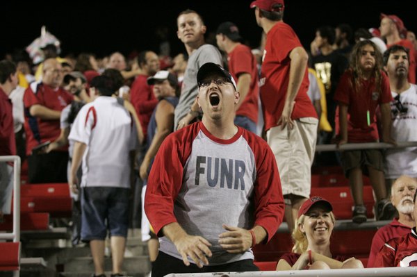 A UNLV fan who refused to give his name yells ...