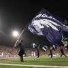 UNR cheerleaders carry their flags after a UNR touchdown during the second half.