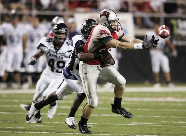 UNR defensive back Mike Evans grabs UNLV wide receiver Ryan ...