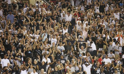 UNR fans cheer during the second half of their game against UNLV at Sam Boyd Stadium.
