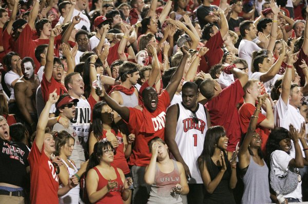 UNLV fans cheer as their team takes the field against ...