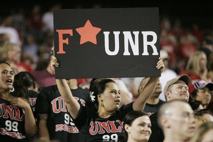 A UNLV fan displays her sentiments during the start of the game against UNR at Sam Boyd Stadium.
