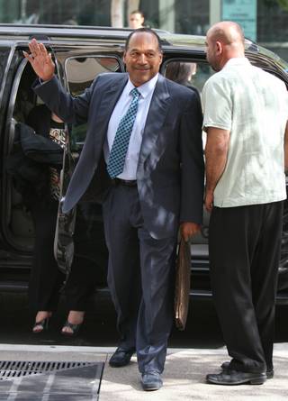 O.J. Simpson arrives for the start of closing arguments in his trial at the Clark County Regional Justice Center Thursday, Oct. 2, 2008, in Las Vegas. Simpson is charged with a total of twelve counts including kidnapping, armed robbery and assault with a deadly weapon stemming from an incident involving the theft of his sports memorabilia. 