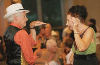 Dance partners Larry Whelan, left, and Suzane Bugg dance it up during a 