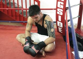Mixed martial arts fighter Robert Drysdale takes a moment to rest during his training session at JSECT Modern Martial Arts in this file photo from 2008.