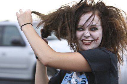 Senior class president Katie Gruenberg teases her hair in preparation for her role on the 2009 senior class float Friday. She will dance to Michael Jackson's song 