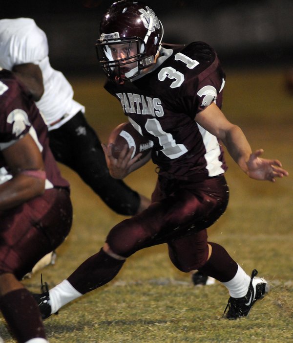 Spartan running back Zach Barbara (31) looks for a gap ...