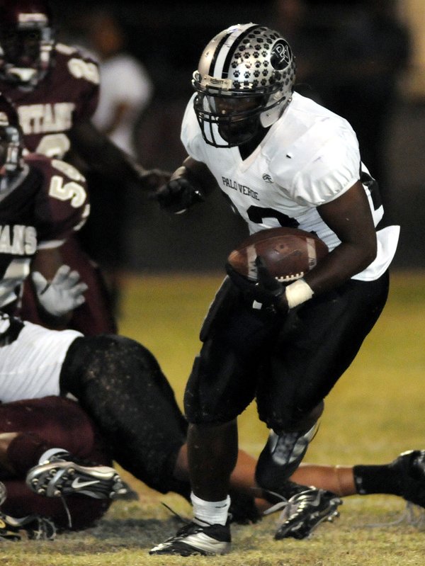 Palo Verde running back Chaz Thomas (22) gets a carry ...